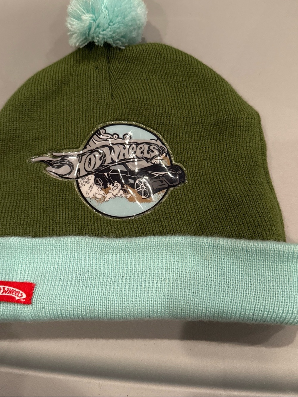Kids Hot Wheels Pom Beanie Hat in Olive Green & Mint